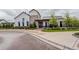 Exterior view of the community clubhouse featuring modern architecture and welcoming landscaping at 9279 Merino Ct # D, Littleton, CO 80125