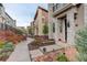 A well maintained townhome property with manicured front yard and pathway at 9279 Merino Ct # D, Littleton, CO 80125
