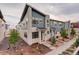 Charming townhome featuring stone accents, low maintenance yard, and modern architectural details at 9279 Merino Ct # D, Littleton, CO 80125