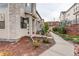 View of the townhome with low-maintenance landscaping and a walkway, providing an inviting approach at 9279 Merino Ct # D, Littleton, CO 80125