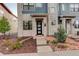 Well-maintained townhome with a welcoming entrance and professionally landscaped front yard at 9279 Merino Ct # D, Littleton, CO 80125