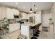 Bright and modern kitchen with white cabinetry, stainless steel appliances, and granite countertops at 9279 Merino Ct # D, Littleton, CO 80125