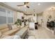 Bright open floor plan showcasing the living room and kitchen with modern finishes at 9279 Merino Ct # D, Littleton, CO 80125