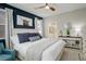 Bright main bedroom with stylish decor, ensuite bath, and large windows at 9279 Merino Ct # D, Littleton, CO 80125