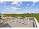 Back deck with grass view on a sunny day at 42754 Calusa Pines Rd, Elizabeth, CO 80107