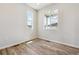 Bright, airy bedroom showcasing new wood flooring, fresh paint, with a view of the outdoors at 42754 Calusa Pines Rd, Elizabeth, CO 80107