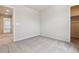 Bedroom with neutral carpet, access to hall and closet, and natural light at 42754 Calusa Pines Rd, Elizabeth, CO 80107