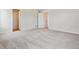 Expansive bedroom features plush carpeting and multiple access doors at 42754 Calusa Pines Rd, Elizabeth, CO 80107