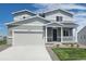 Charming two-story home with a two car garage, a cozy front porch, and meticulous landscaping at 42754 Calusa Pines Rd, Elizabeth, CO 80107