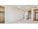 Upstairs hallway with neutral carpet, access to multiple rooms, and ample lighting at 42754 Calusa Pines Rd, Elizabeth, CO 80107