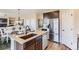 Spacious kitchen with island, stainless steel appliances, and open layout for entertaining and cooking at 42754 Calusa Pines Rd, Elizabeth, CO 80107