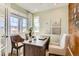 Bright office space with large windows, a modern desk, and stylish decor for a productive workspace at 42754 Calusa Pines Rd, Elizabeth, CO 80107