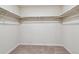 Interior view of a walk-in closet with clothing racks at 42754 Calusa Pines Rd, Elizabeth, CO 80107