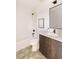 Modern bathroom featuring a shower-tub combination, sleek fixtures, and updated vanity at 16133 W 14Th Ave, Golden, CO 80401