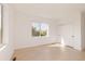 Bright bedroom with light hardwood flooring and sliding closet doors, and a large window at 16133 W 14Th Ave, Golden, CO 80401