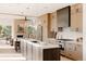 Bright, modern kitchen featuring a large island with white countertops and stainless steel appliances at 16133 W 14Th Ave, Golden, CO 80401