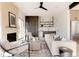 Cozy living room with fireplace, modern furniture, and bar area with modern cabinets at 16133 W 14Th Ave, Golden, CO 80401