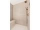 Modern shower showcasing a rainfall shower head, bench, and tiled walls at 16133 W 14Th Ave, Golden, CO 80401