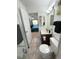 Clean bathroom leading to a bedroom, featuring modern fixtures and a seamless transition between spaces at 4676 White Rock Cir # 12, Boulder, CO 80301