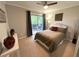 Cozy bedroom features a ceiling fan and a sliding glass door to a private balcony at 4676 White Rock Cir # 12, Boulder, CO 80301