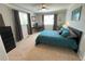 Bedroom showcasing a comfortable bed, a ceiling fan, and a dedicated workspace for added convenience and functionality at 4676 White Rock Cir # 12, Boulder, CO 80301