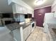 Open kitchen with granite countertops, breakfast bar, and white appliances at 4676 White Rock Cir # 12, Boulder, CO 80301
