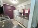 Updated kitchen with granite countertops, stainless steel sink, and white appliances at 4676 White Rock Cir # 12, Boulder, CO 80301