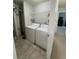 Laundry area with side by side washer and dryer hookups and wire shelving at 4676 White Rock Cir # 12, Boulder, CO 80301