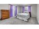 Cozy bedroom featuring soft gray carpet, natural light, and a spacious dresser for ample storage at 891 Ursula St, Aurora, CO 80011
