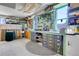 Well-organized garage with a workbench and storage, ideal for DIY projects at 891 Ursula St, Aurora, CO 80011