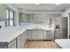 Bright kitchen features modern appliances and quartz countertops at 891 Ursula St, Aurora, CO 80011