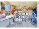Well-lit shed interior with organized shelving and ample storage space at 891 Ursula St, Aurora, CO 80011