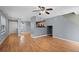 Hardwood floors flow through the living room, connecting to the kitchen and entryway at 848 Mockingbird Ln, Brighton, CO 80601