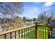 Relaxing view of green lawn, trees, and community parking from the unit's cozy balcony at 16359 W 10Th Ave # X6, Golden, CO 80401