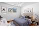 Cozy bedroom with natural light, a comfortable bed, and a dedicated desk area at 16359 W 10Th Ave # X6, Golden, CO 80401