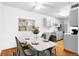 Dining area with a marble-top table, seating for four, and stainless steel appliances at 16359 W 10Th Ave # X6, Golden, CO 80401
