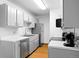 Galley kitchen with stainless steel appliances, light gray cabinets, and white countertops at 16359 W 10Th Ave # X6, Golden, CO 80401