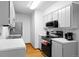Updated kitchen with modern appliances, light gray cabinetry, and ample counter space at 16359 W 10Th Ave # X6, Golden, CO 80401