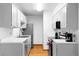 Efficient kitchen with stainless steel appliances, ample storage, and white countertops at 16359 W 10Th Ave # X6, Golden, CO 80401