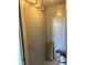 A closet with coat hooks is being used to hold paint and other supplies at 16359 W 10Th Ave # X6, Golden, CO 80401