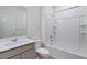 Clean, well lit bathroom with shower, vanity, sink, mirror, and toilet at 13489 Valentia Pl, Thornton, CO 80602