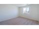 Bedroom features neutral walls, carpet, and one window at 13489 Valentia Pl, Thornton, CO 80602