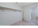 Walk-in closet with a closet rod, shelving and neutral carpet at 13489 Valentia Pl, Thornton, CO 80602