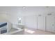 Upstairs hallway with plush carpet, natural light, and crisp white trim at 13489 Valentia Pl, Thornton, CO 80602