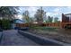Large backyard features new fence, brick patio area and plenty of space to customize at 2441 W 55Th Ave, Denver, CO 80221