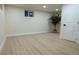 Basement is finished with recessed lighting and wood-look floors at 2441 W 55Th Ave, Denver, CO 80221