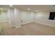Basement area features modern flooring, natural light, and flexible open space at 2441 W 55Th Ave, Denver, CO 80221