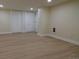 Spacious basement features modern floors, neutral colors, and multiple closets at 2441 W 55Th Ave, Denver, CO 80221