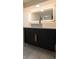 Modern bathroom features a vessel sink, backlit mirror, and high end fixtures at 2441 W 55Th Ave, Denver, CO 80221