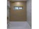 Updated bathroom featuring a bathtub and shower with gold fixtures and light tile at 2441 W 55Th Ave, Denver, CO 80221